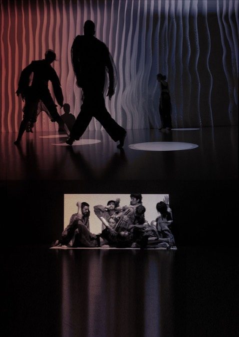 Dancers silhouetted against striped projections in the Room no.0 performance.